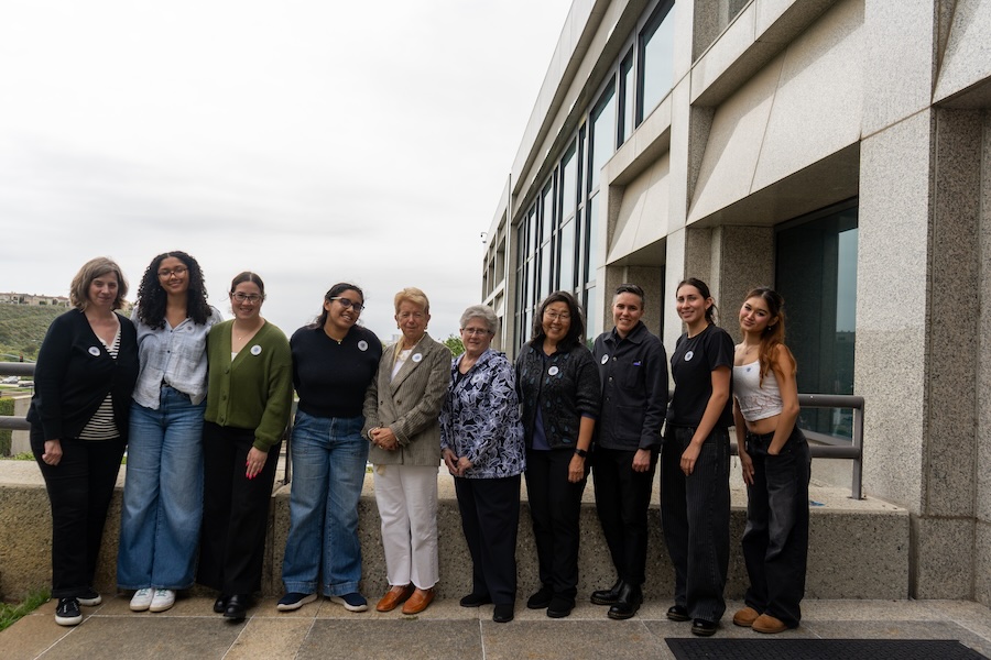 Group photo outdoors of students and faculty affiliated with Marymount Traditions course